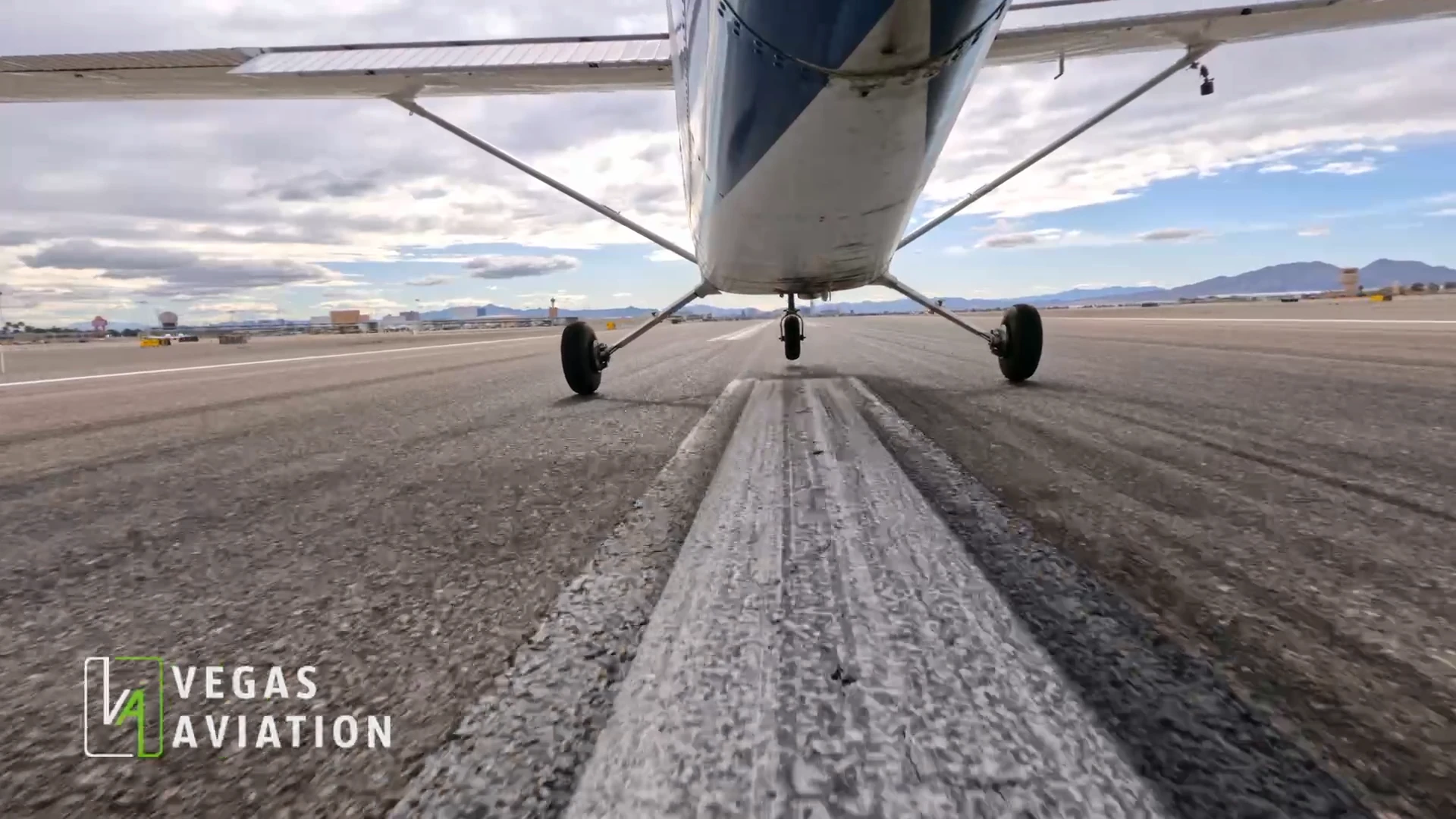 Single-engine airplane taking off from a runway in Southern Nevada